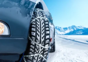 Anshor Driving School spends a lot of time teaching defensive driving, but winter in Colorado adds a second layer: you can do everything “right” behind the wheel and still end up stuck, sliding, or blocking a lane if your vehicle is not equipped for the conditions. That’s exactly why the Colorado Department of Transportation updated its Passenger Vehicle Traction (PVT) rules for the 2025 season, and why enforcement during storms is getting more direct and more visible. This is not just “mountain driving advice.” CDOT can activate the Traction Law on any state highway when weather and road conditions require it. On the I-70 Mountain Corridor, the Traction Law is also in effect each year from September 1 through May 31. If you’re a new driver, a parent helping a teen, or an adult who simply does not drive the mountains often, understanding the requirements now will save you stress when the overhead signs light up. Quick Answer: Colorado’s Updated Traction Law and What You Need To Know This Winter Colorado’s Traction Law can be activated on state highways during winter conditions. AWD or 4WD vehicles may comply with properly rated tires and at least 3/16-inch tread. For 2WD vehicles, compliance typically requires carrying chains or an approved traction device, and installing them when restrictions are active. What the Traction Law Requires During Storms CDOT’s updated guidance is simple on paper, but the details matter. When the Passenger Vehicle Traction Law is active, 4WD and AWD vehicles can comply with qualifying tires (3/16-inch tread and the proper rating) or by using chains or an approved ATD, and under current Colorado State Patrol guidance tied to SB25-069, 2WD vehicles are expected to use chains or an approved ATD rather than relying on tires alone. AWD/4WD with tires that have at least 3/16-inch tread depth and are rated as all-weather, mud and snow (M+S / M&S / M/S), or winter tires (3PMSF mountain-snowflake icon), or Chains or an approved Alternative Traction Device (ATD) on two or more drive tires The big change that catches people off guard is how two-wheel drive (2WD) is treated under the updated rules explained by the Colorado State Patrol: From September 1 to May 31, 2WD vehicles on the I-70 Mountain Corridor must carry chains or an approved ATD. When the Traction Law is active, 2WD vehicles must have chains or an ATD installed on two or more drive tires. Under current Colorado State Patrol guidance for SB25-069, upgrading to M+S or winter-rated tires does not bring a 2WD vehicle into compliance by itself when the Passenger Vehicle Traction Law is active. That last point matters for a lot of small sedans and compact cars, especially if you’re focused on defensive driving. Tires help, but for 2WD, Colorado State Patrol guidance under SB25-069 is clear that “tires only” is not the compliance path when the law is active. When Traction Law Turns Into Chain Law During severe winter storms, CDOT may implement the Passenger Vehicle Chain Law as a final safety measure before a highway is closed. When that Chain Law is in effect, every vehicle must have chains or an approved alternative traction device. In other words, don’t assume AWD saves you from chains in the worst conditions. The escalation path exists specifically because storms can overwhelm even well-equipped vehicles. How Enforcement Works (and How You’ll Know It’s Active) Drivers are alerted through: Roadway signage, including electronic message boards and overhead signs COtrip.org road condition updates and travel alerts Text and email alerts through CDOT’s subscription tools (plus other public messaging) Practically speaking, “enforcement” starts with the signs. When the overhead signs indicate the law is in effect, the expectation is that you’re already equipped and, if required, already chained up. And yes, there are real penalties. CDOT lists passenger-vehicle fines for noncompliance as a $100 fine plus a $33 surcharge, and says failures that result in a travel lane closure can include a $500 fine plus a $157 surcharge, and Colorado State Patrol also notes that winter-restriction penalties for chain-law and must-carry violations can be up to a $500 fine plus a $79 surcharge, or $1,000 plus a $157 surcharge if you’re stuck and blocking any traveled portion of the roadway. The Anshor Winter Readiness Checklist We Teach Whether you drive near Greeley, Alamosa, Salida, La Junta, or head into the high country, this is the prep we want our students to do before the first major storm. (And if you’re teaching a teen, do it together so they know where everything is.) Check your drivetrain. If you’re 2WD, plan on chains or an approved ATD as your compliance tool when the Passenger Vehicle Traction Law is active, based on current Colorado State Patrol guidance. Check tire type and tread depth. For AWD/4WD, confirm the tire rating and that you have at least 3/16-inch tread. Carry chains or ATDs, and practice installing them. The side of the road in a snow squall is not where you want your first attempt. Monitor conditions before you leave. Use COtrip and don’t “hope it clears” if restrictions are spreading. Give plows room and respect winter operations. CDOT reminds drivers to give snowplows space and stay back several car lengths behind them. Colorado’s traction rules are not meant to punish drivers. They’re meant to prevent the most common winter failure point: one unprepared vehicle losing traction and turning a bad weather day into a multi-hour closure. If you want help building true winter-driving confidence, our behind-the-wheel lessons focus on real-world decision-making, including how to plan routes, read conditions, and avoid the common mistakes that show up every storm cycle. Final Thoughts on Colorado’s Updated Traction Law and What Drivers Need This Winter Winter driving in Colorado is not just about skill, it’s about preparation. Knowing when the Traction Law applies, what your vehicle must carry, and how to respond when signs light up helps you stay safe and keep roads moving. If you want calm, real-world coaching, book behind-the-wheel lessons at Anshor Driving School.